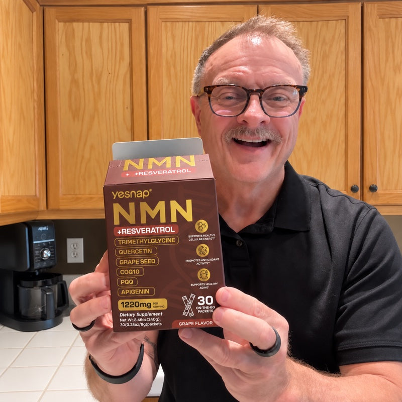 Person holding Yesnap NMN — cleaned from supplied photo