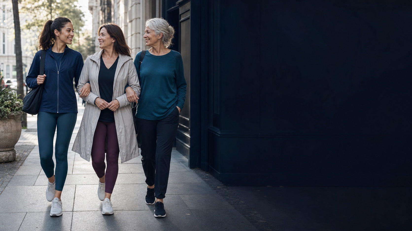 Three women of different ages walking together with confidence